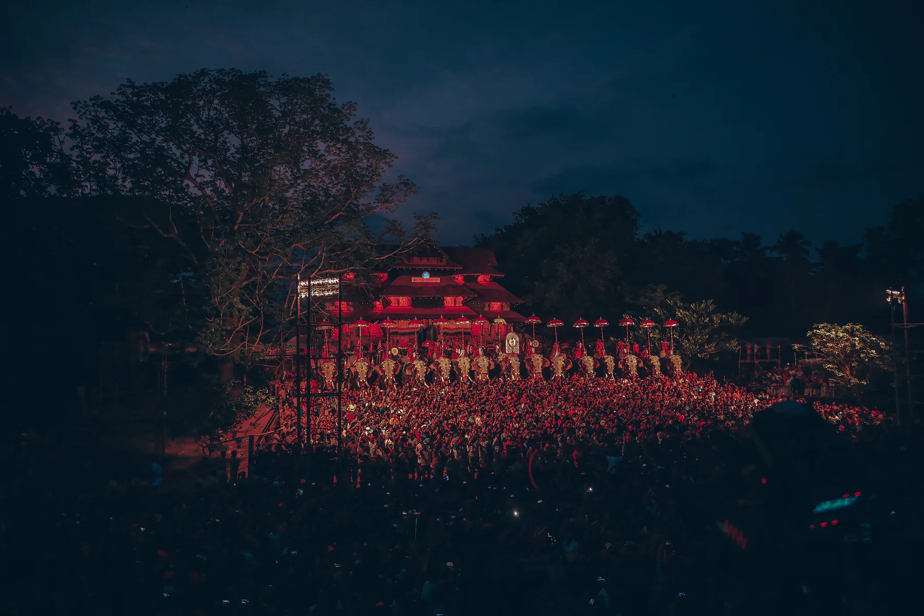“Dazzling Thrissur Pooram night with caparisoned elephants and illuminated temple, Kerala”